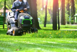 ride on mower cutting grass